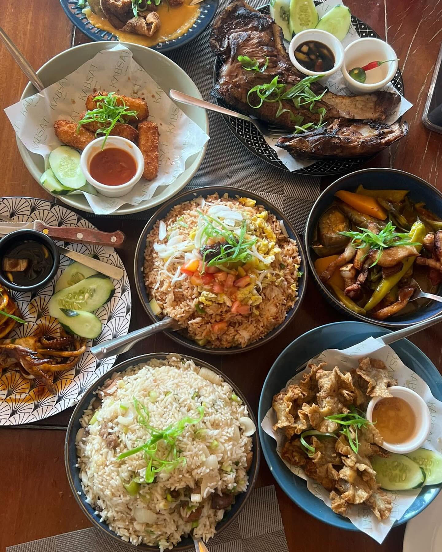 Kabsat La Union table spread with rice, grilled meats, and sides