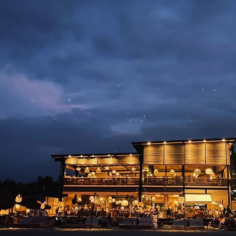 Kabsat La Union full building lit at night from the beach